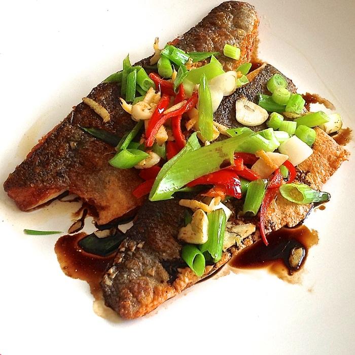 Sea bass with sizzled ginger, chilli & spring onions recipe